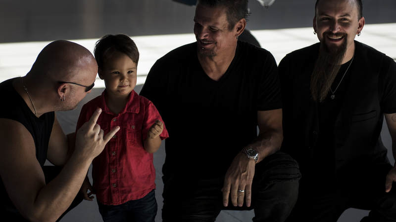Members of the band Disturbed meet Air Force families during a tour of Nellis Air Force Base, Nevada, October 24.