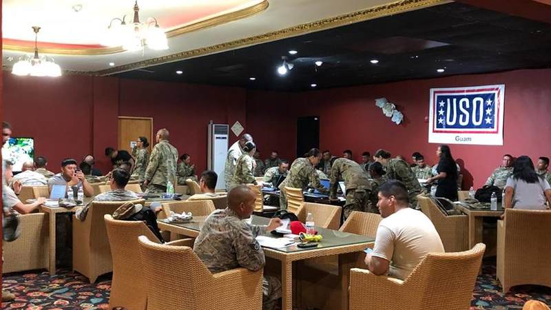 Service members enjoy a moment of relaxation in the temporary USO center built on the island of Saipan.