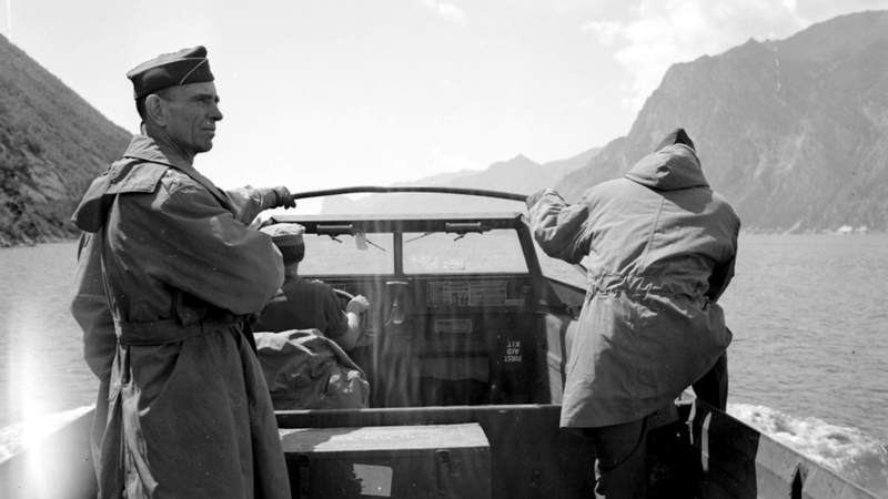 10th Mountain Division commander Army General George P. Hays, left, leads an American amphibious vehicle as it crosses an Italian lake during World War II.