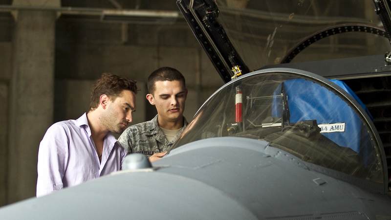 "The Big Bang Theory" star Johnny Galecki gets a preview the cockpit of an F-15 aircraft by Air Force 1st Lt. Jason Breazeale during a 2012 USO tour to the Pacific.