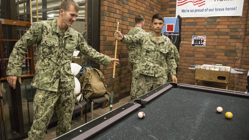 Navy Seabees play a game of pool Feb. 8 during a short layover at USO Ontario.
